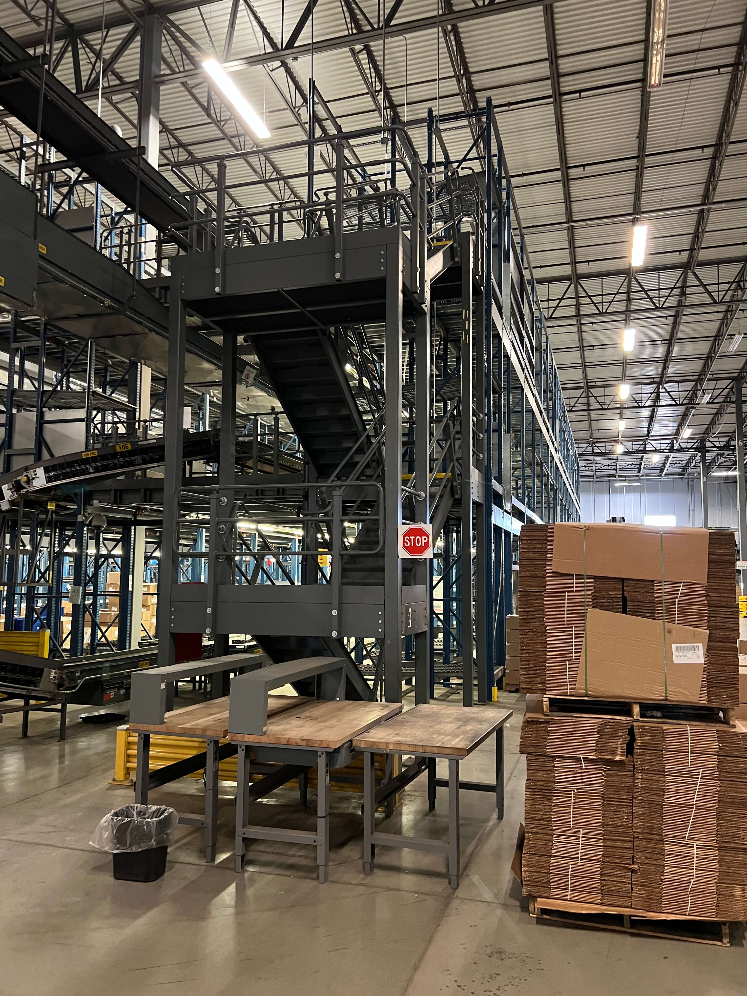 Pick module, stairs and conveyor documented at a Louisville supply-chain facility