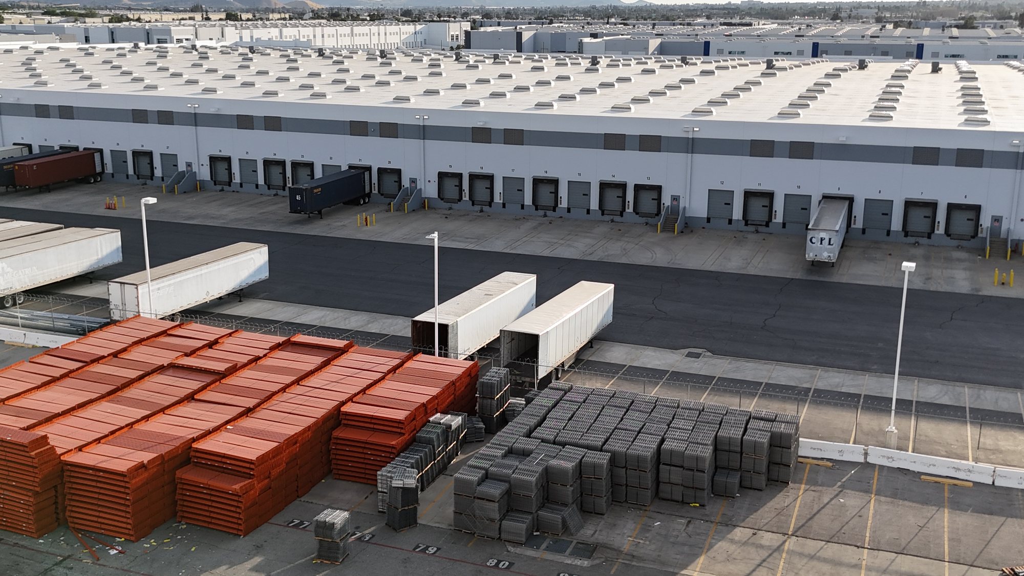 Rack material staged outside a large distribution facility