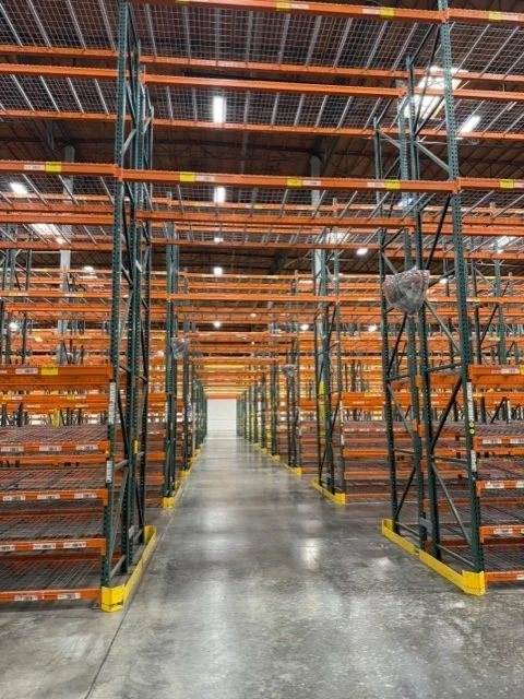 Completed pallet-rack aisles inside a warehouse